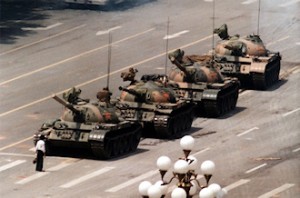 The "Tank Man" trying to block the way of tanks with his own body alone during the Tiananmen Square protests of 1989. (Photo: Jeff Widener)